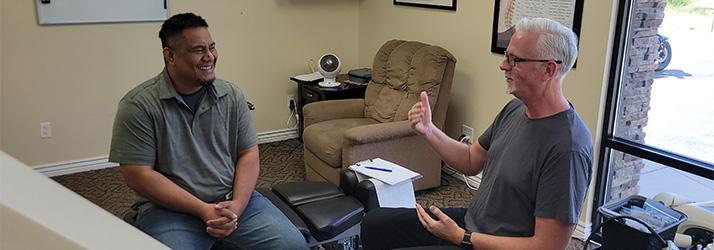 Chiropractor Ogden UT Peter Raether With Patient Contact Us